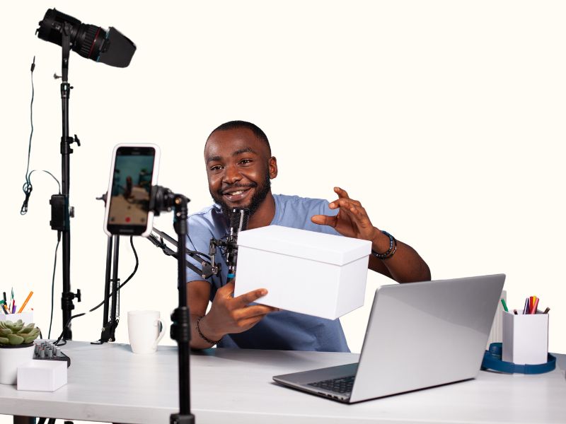 African man doing a video demo of a product